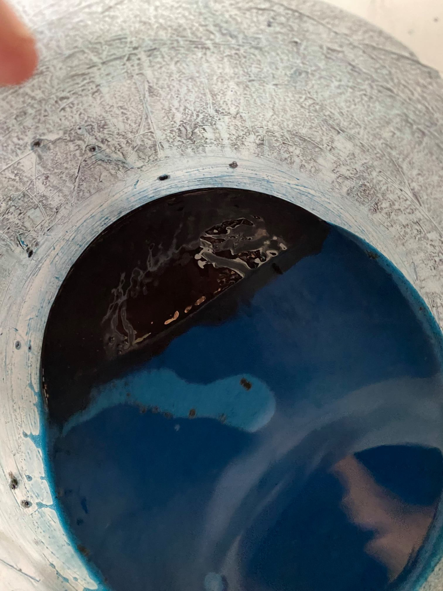 Grout after water has set and pigments settled for 60 seconds