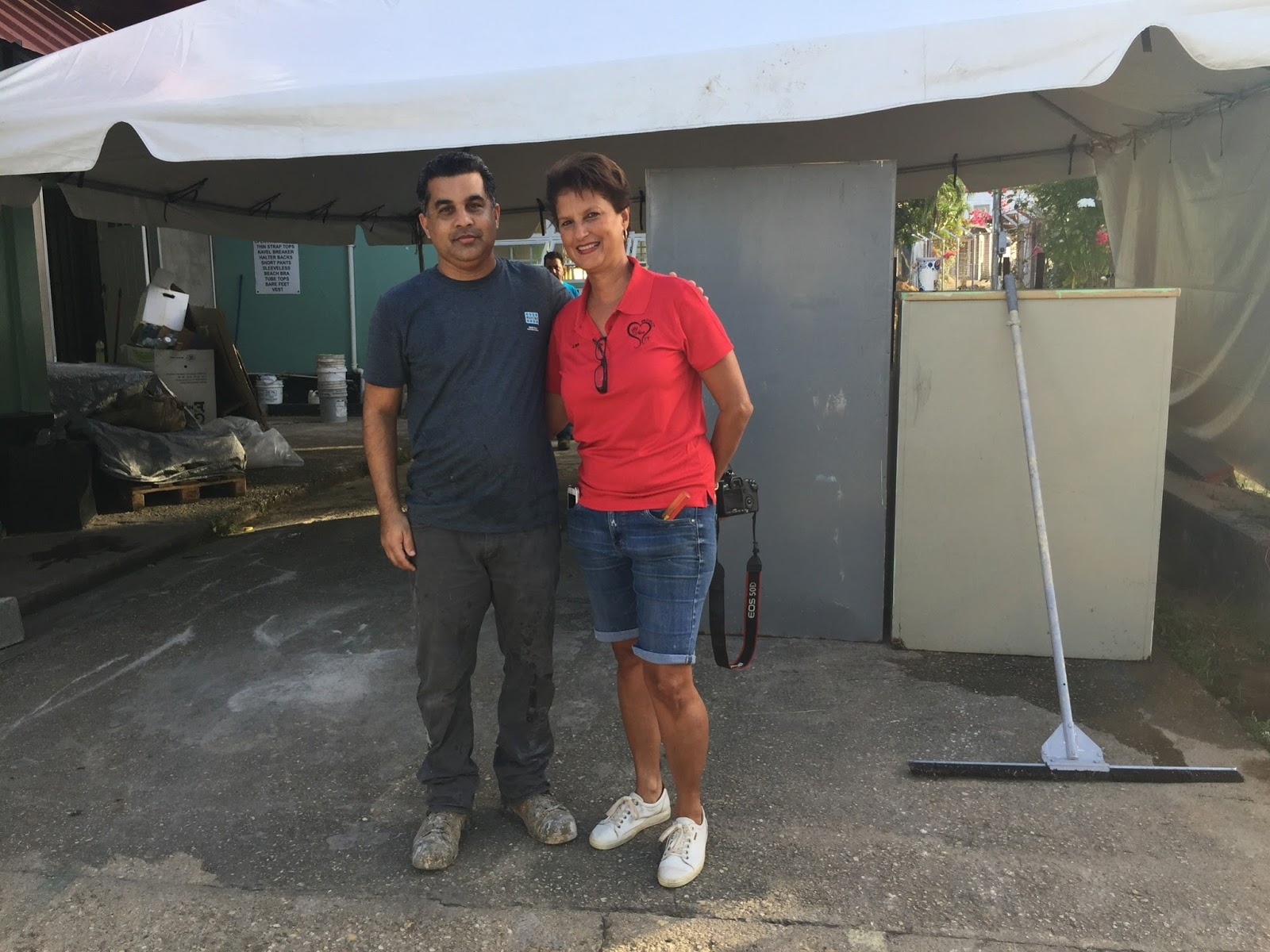 Ryan Ali with Leslie Warner, Chairperson, Project CareTT