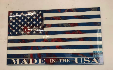 American flag made out of SPARTACOTE resinous flooring products from LATICRETE hanging over the office door at Desoto Sales, Inc. in North Highlands, California