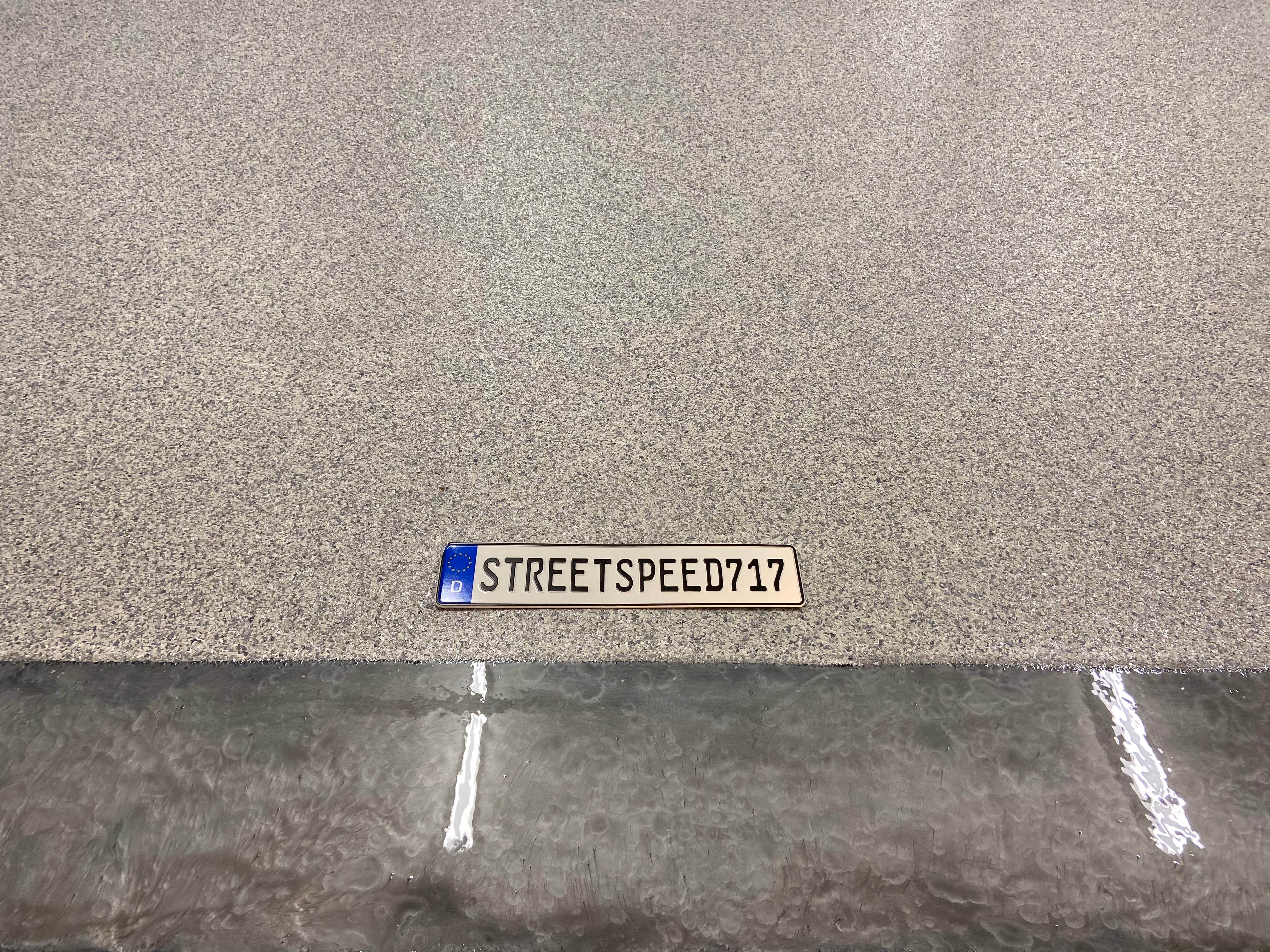 SPARTACOTE resinous flooring garage makeover in SPARTACOTE Chip and SPARTACOTE Metallic coatings